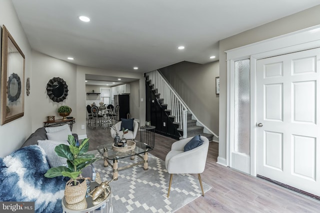 living room with light hardwood / wood-style flooring