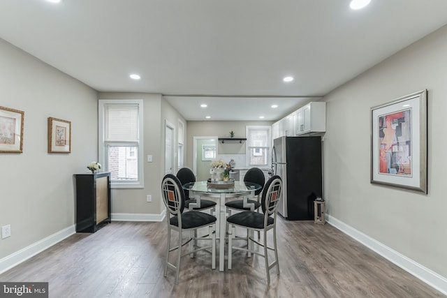 dining area with hardwood / wood-style flooring