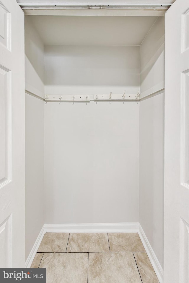 spacious closet featuring tile patterned floors