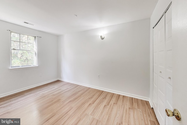 unfurnished room featuring light hardwood / wood-style floors