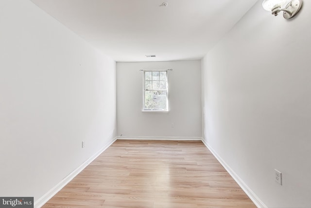 spare room featuring light hardwood / wood-style floors