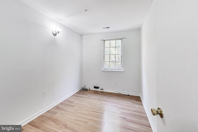 unfurnished room featuring light hardwood / wood-style flooring