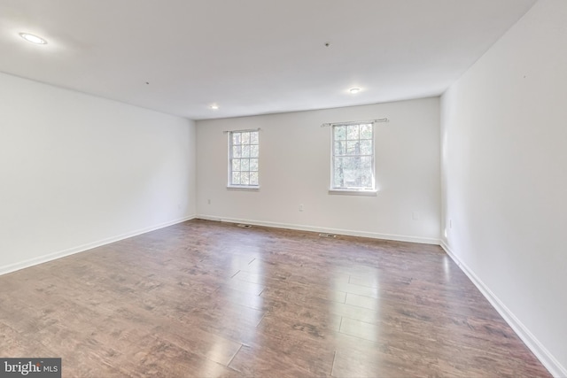 empty room featuring dark hardwood / wood-style floors