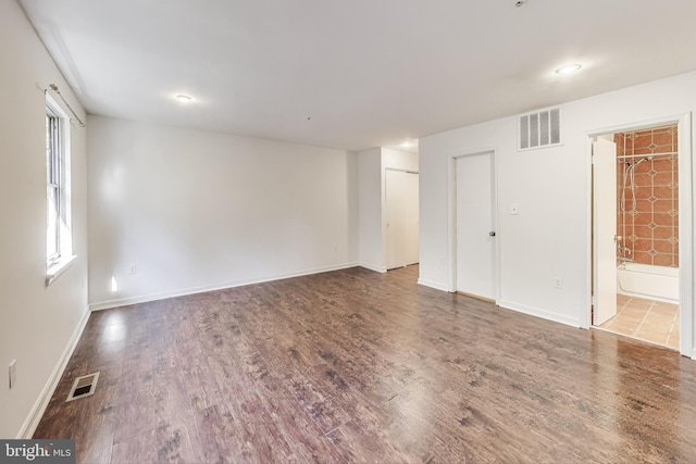 empty room featuring hardwood / wood-style flooring