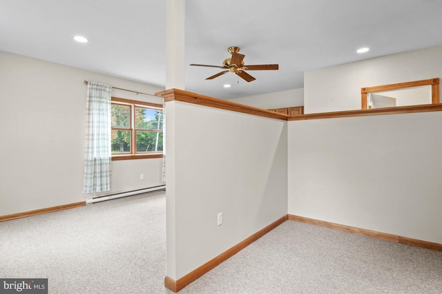 empty room with carpet floors, ceiling fan, and a baseboard radiator