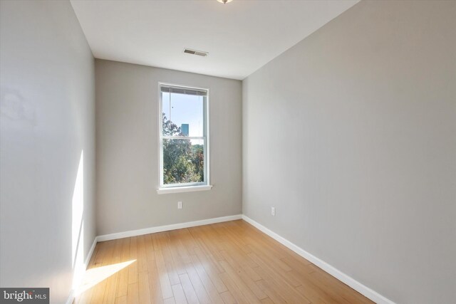 unfurnished room featuring light hardwood / wood-style flooring