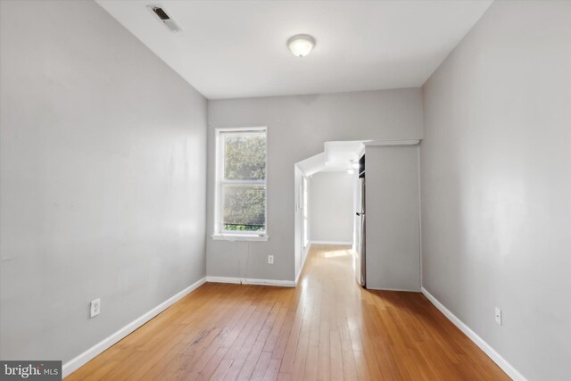 unfurnished room featuring light hardwood / wood-style flooring