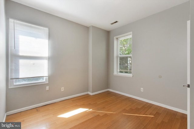 1716 N 18th St, Philadelphia, PA 19121 - spare room with baseboards, visible vents, and wood finished floors