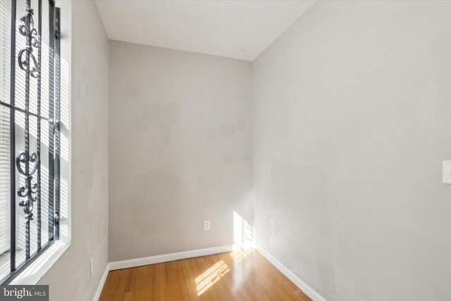 empty room with hardwood / wood-style floors