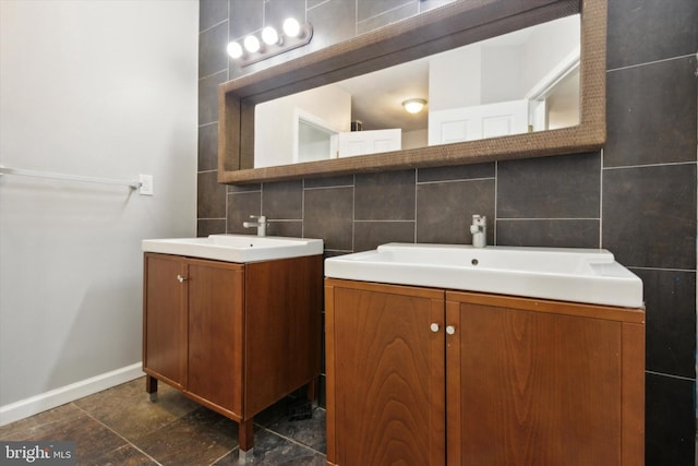 bathroom featuring vanity, backsplash, and tile walls