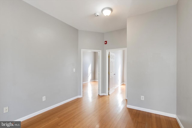 spare room with light hardwood / wood-style flooring