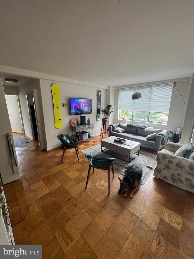 living room with parquet flooring