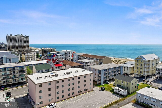 bird's eye view with a water view and a view of the beach