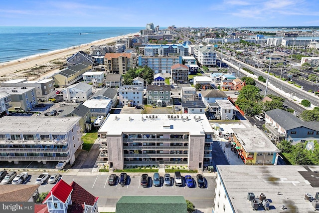 birds eye view of property with a view of the beach and a water view