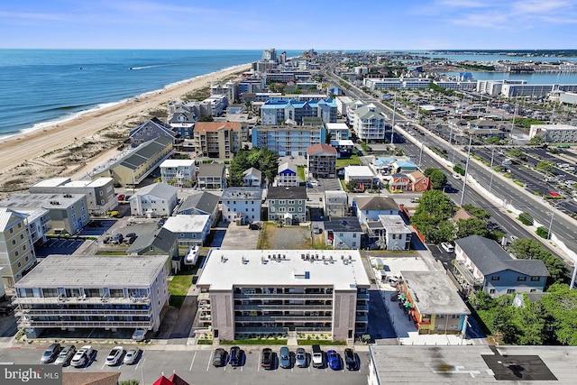 drone / aerial view with a view of the beach and a water view