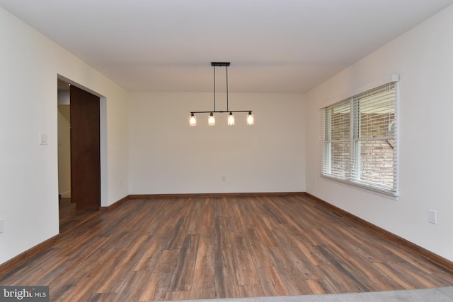 empty room featuring dark hardwood / wood-style floors