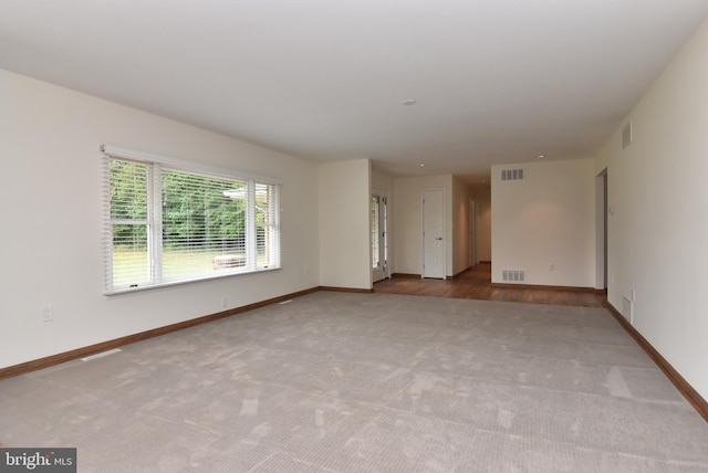 unfurnished room with light hardwood / wood-style floors