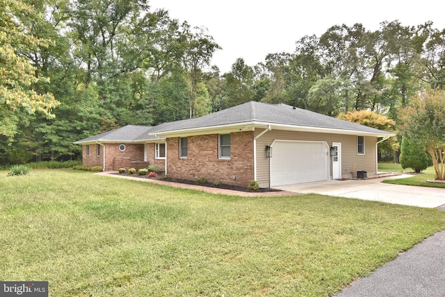 single story home featuring a front yard and a garage