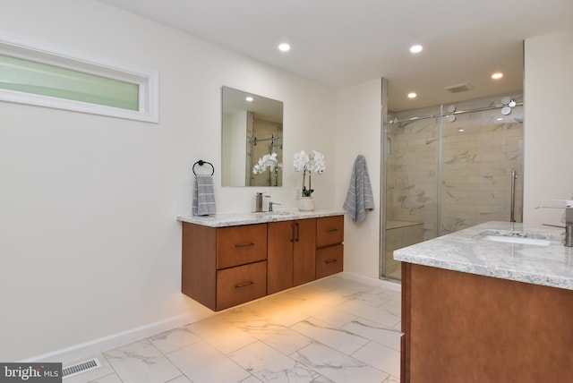 bathroom with vanity and walk in shower