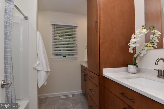 bathroom featuring vanity and shower / tub combo with curtain