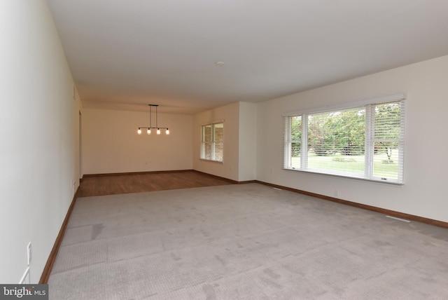 spare room with light wood-type flooring