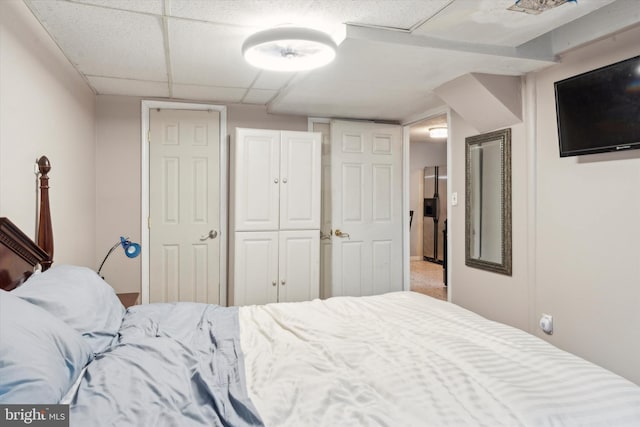 bedroom featuring a paneled ceiling