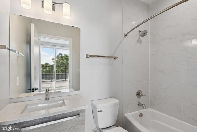 full bathroom featuring vanity, toilet, and tiled shower / bath combo