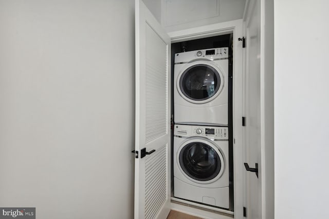 laundry room with stacked washer and clothes dryer