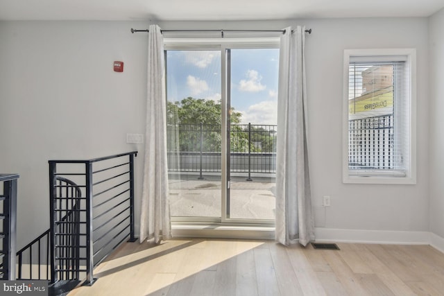 doorway with light hardwood / wood-style flooring