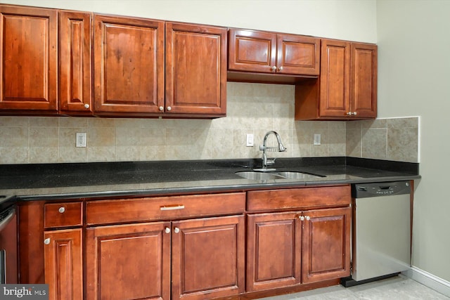 kitchen featuring decorative backsplash, sink, and stainless steel dishwasher