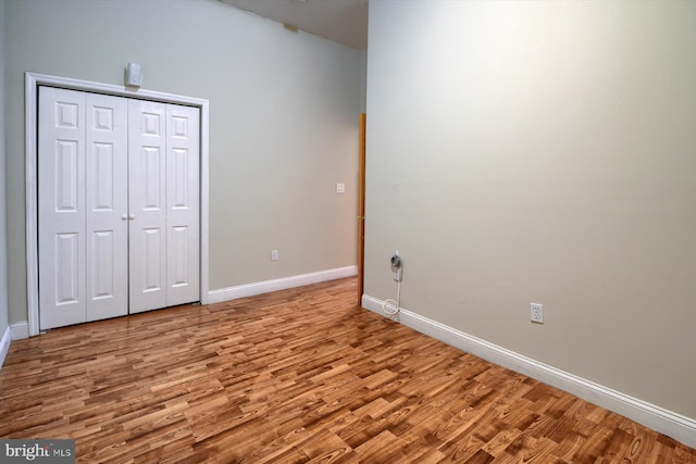 unfurnished bedroom featuring light wood-type flooring