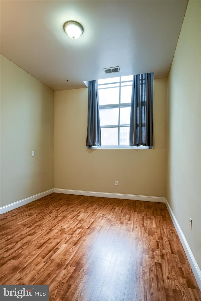 spare room featuring light hardwood / wood-style floors