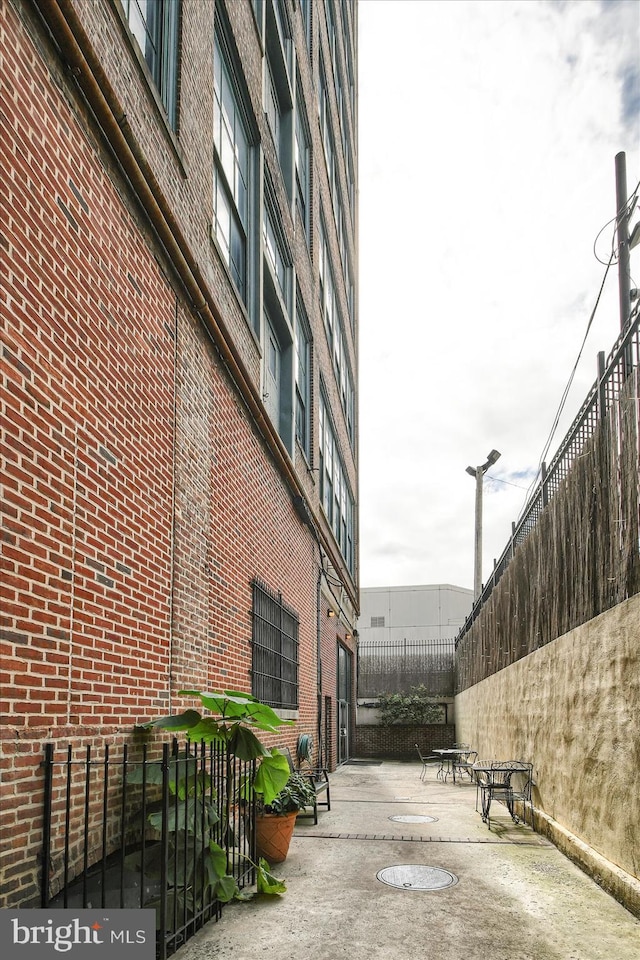 view of property exterior with a patio