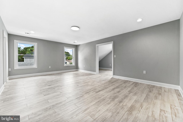 unfurnished room featuring light hardwood / wood-style flooring