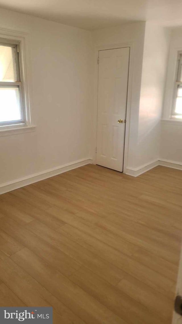 empty room with light wood-type flooring