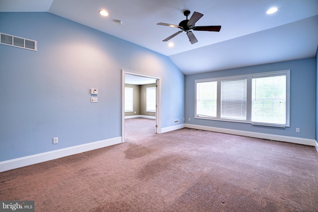 unfurnished living room featuring lofted ceiling, ceiling fan, and plenty of natural light