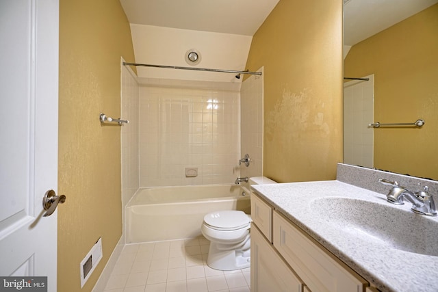 full bathroom featuring tile patterned floors, tiled shower / bath combo, vanity, and toilet