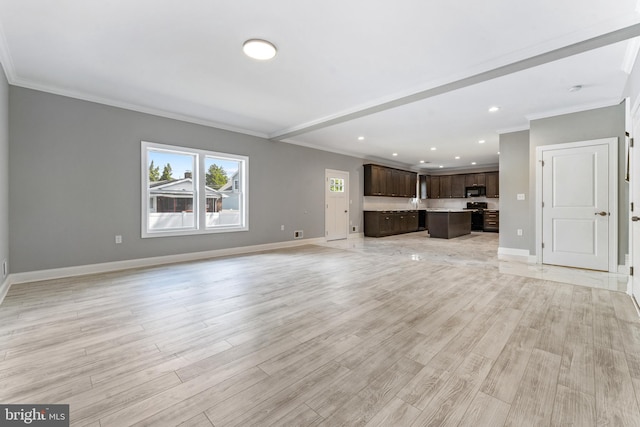 unfurnished living room with light wood-type flooring and ornamental molding