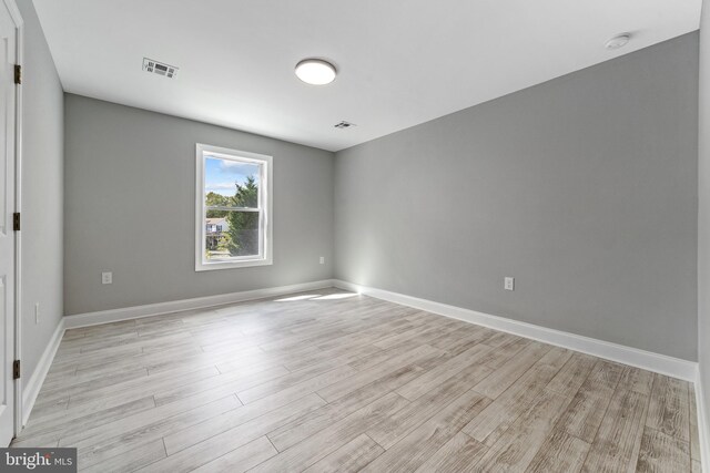 1406 Circle Dr, Forked River, NJ 08731 - empty room with visible vents, baseboards, and light wood-style flooring