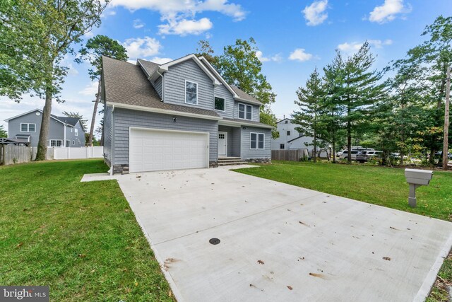 1406 Circle Dr, Forked River, NJ 08731 - traditional-style home with a front yard, driveway, and fence