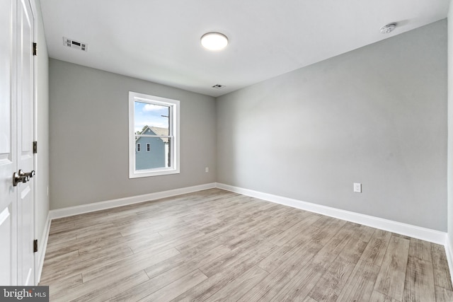 unfurnished room with light hardwood / wood-style floors