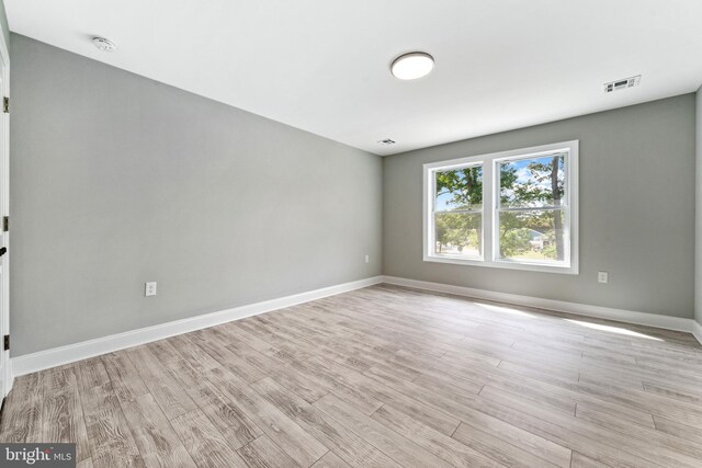 1406 Circle Dr, Forked River, NJ 08731 - spare room featuring visible vents, baseboards, and light wood finished floors