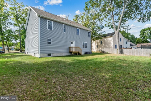 1406 Circle Dr, Forked River, NJ 08731 - back of property featuring a yard, central AC, and fence