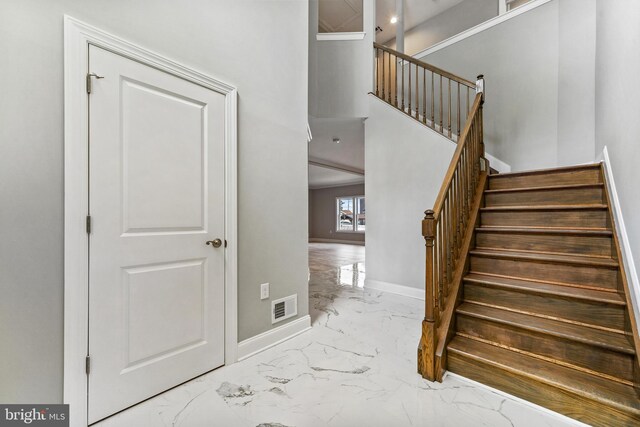 1406 Circle Dr, Forked River, NJ 08731 - staircase with visible vents, marble finish floor, and baseboards