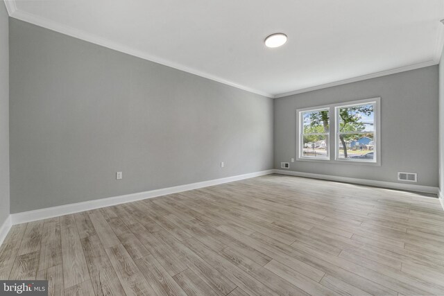 1406 Circle Dr, Forked River, NJ 08731 - empty room with crown molding, visible vents, baseboards, and light wood finished floors