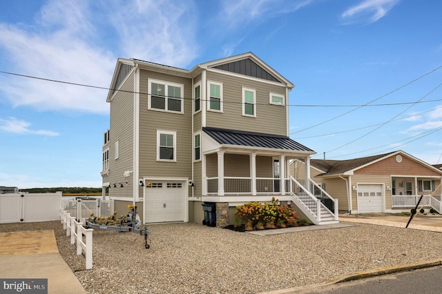 view of front of house featuring a porch and a garage