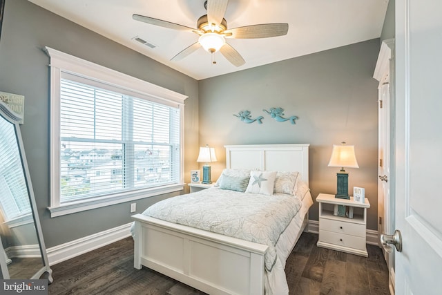 bedroom with dark wood-type flooring and ceiling fan