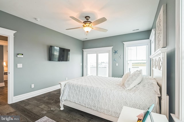 bedroom with ceiling fan and dark hardwood / wood-style floors