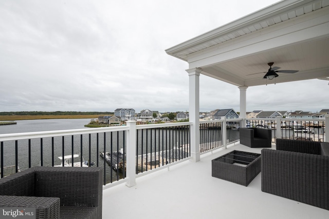 view of patio / terrace with a balcony, an outdoor hangout area, a water view, and ceiling fan