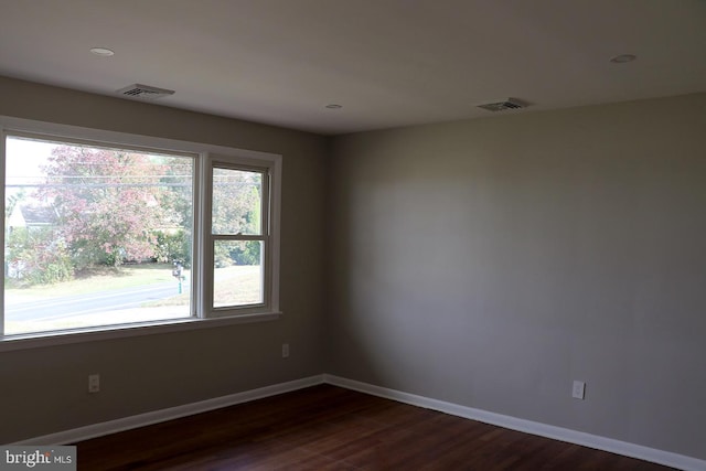 empty room featuring hardwood / wood-style flooring